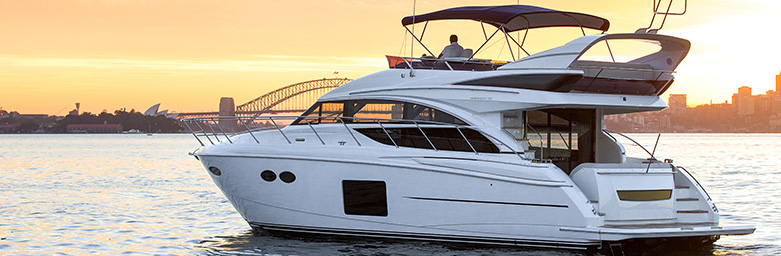 A sailing motor boat during sunset