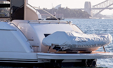 A white motor boat staying in harbour